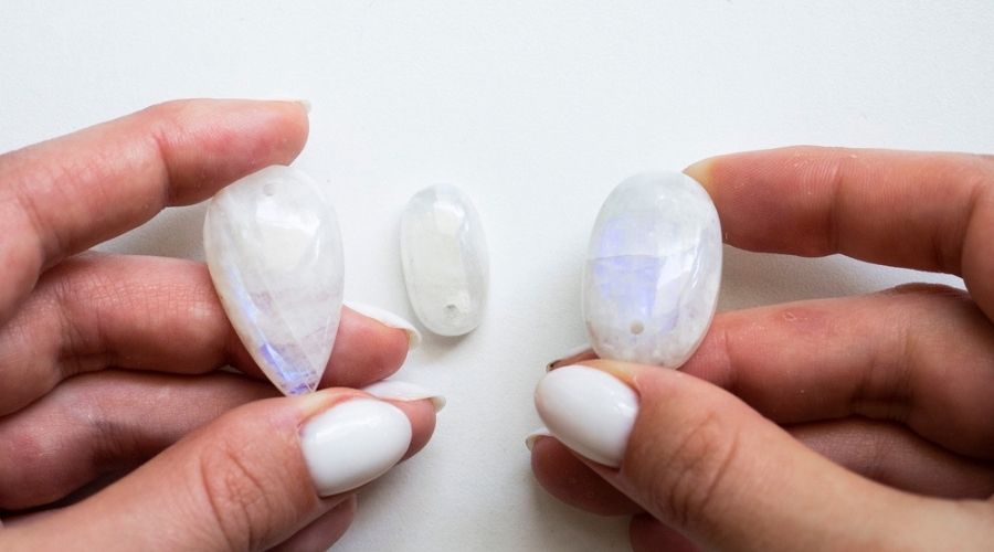 White_Moonstones_in_a_womans_hands.jpg